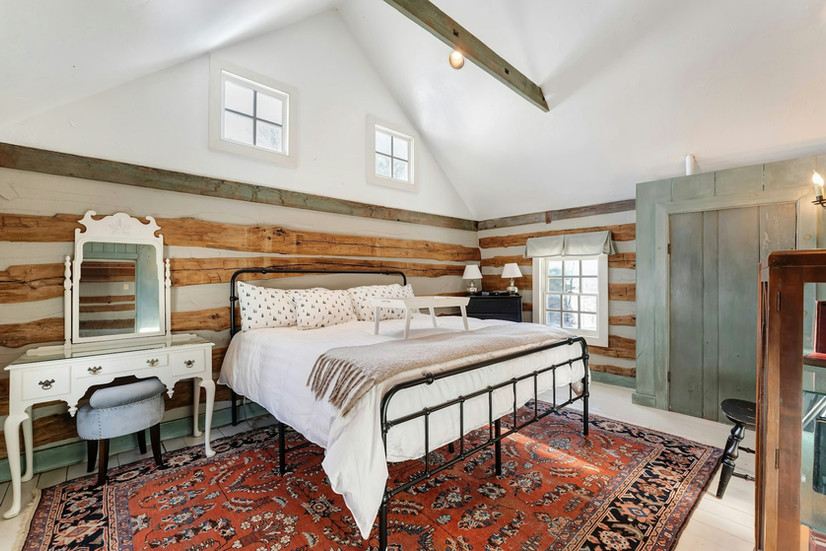 Bedroom at Historic log house at Hideaway Springs Farm