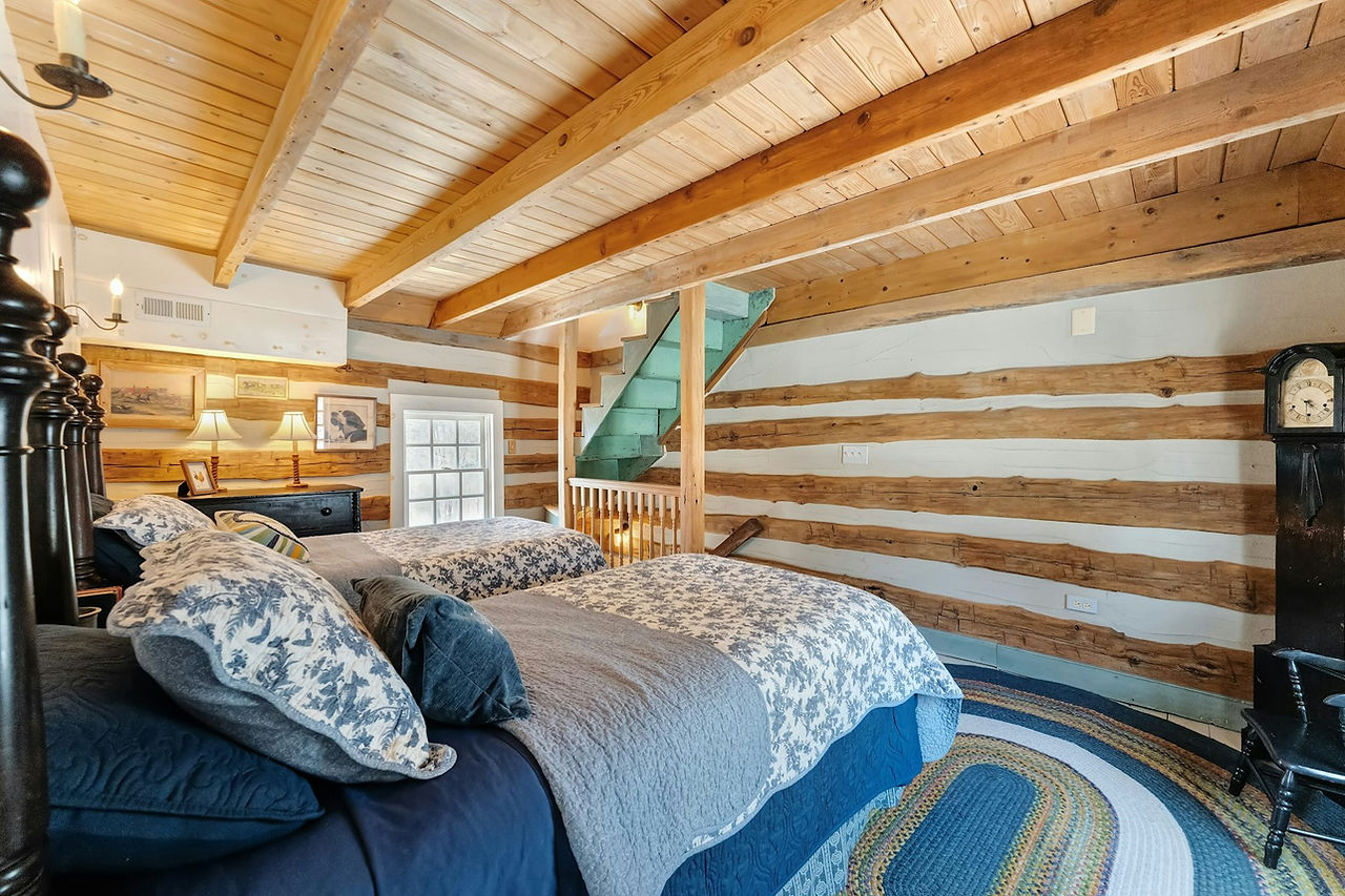 Bedroom at Historic log house at Hideaway Springs Farm