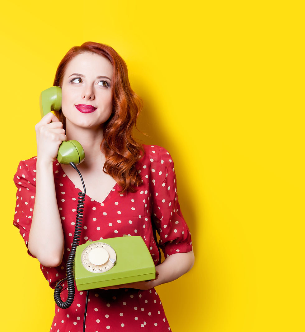 Woman in red holding rotary phone