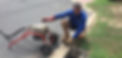 Plumber clearing blocked drains with a drain electric eel machine.