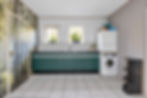 Moderne wasruimte met groene kasten en witte wasmachine.