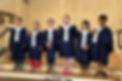 Caroler choir of second and third graders singing during worship