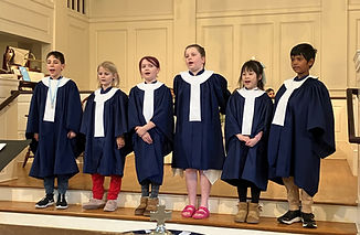 Group of kids standing in sanctuary singing