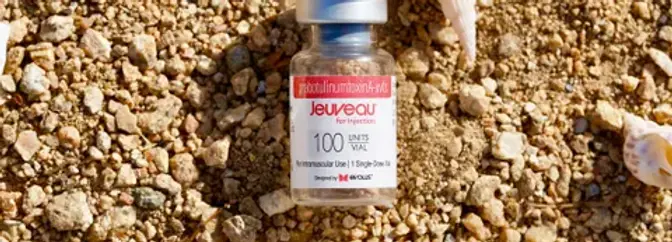 Vial of Jeuveau neurotoxin Beach sand and shells