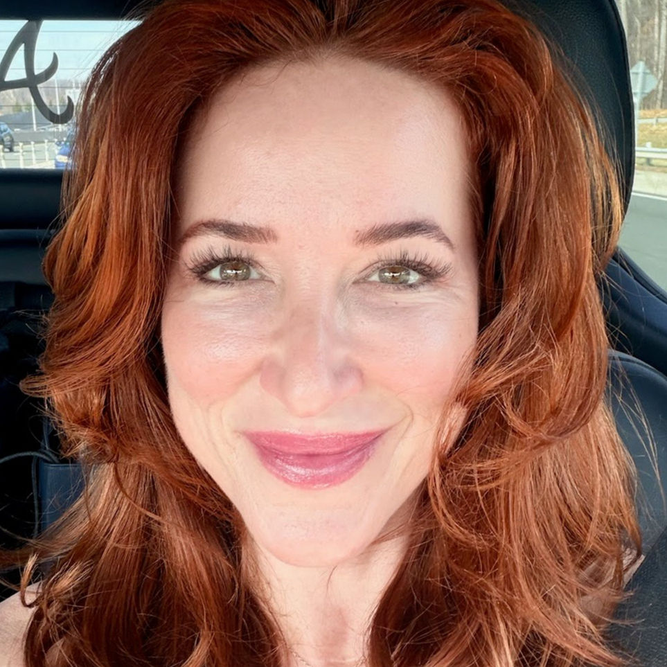 Smiling woman with long hair post treatment