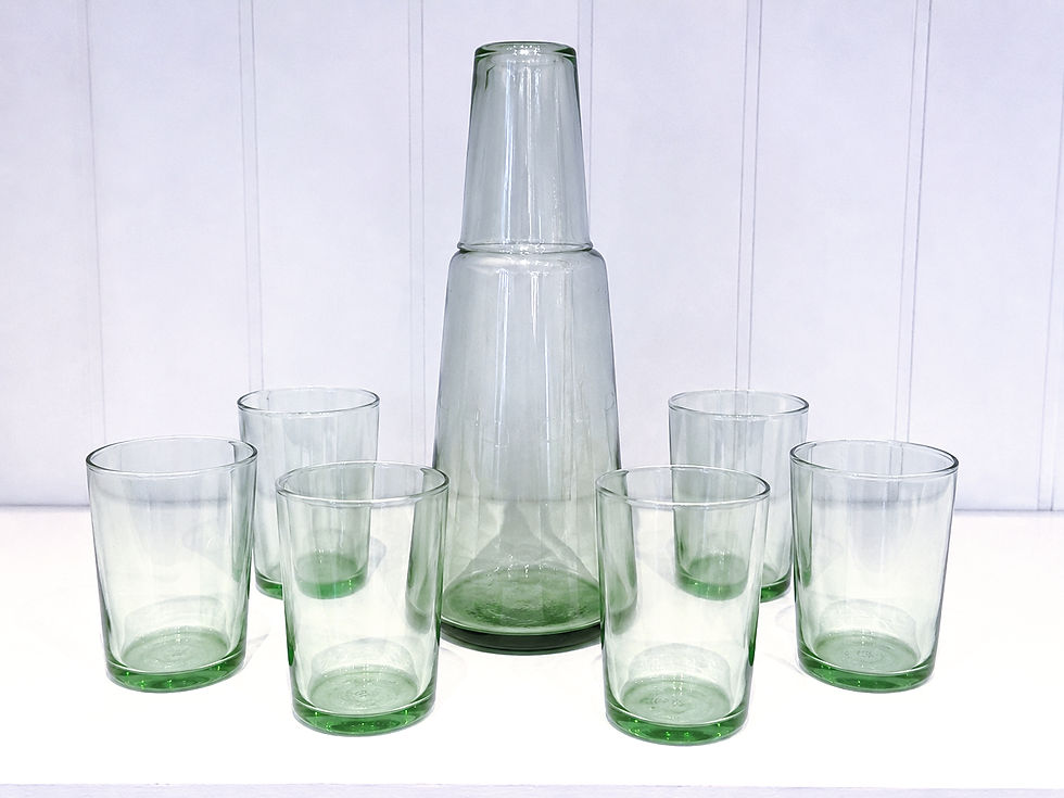 Thumbnail: Green glass carafe surrounded by eight matching green glass tumblers on a white background.