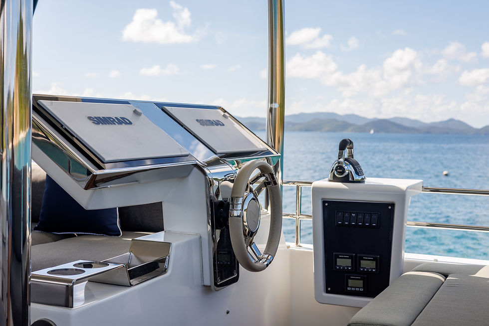 Eye-level view of a catamaran deck with calm sea in the background
