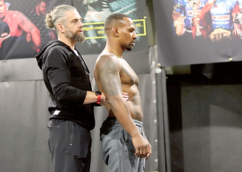 A man with his coach during a training
