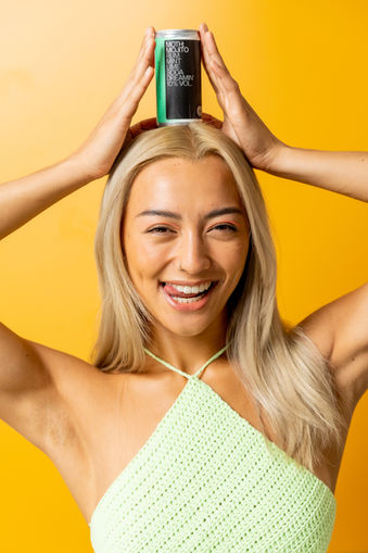Fun happy model with cocktail in a can drink