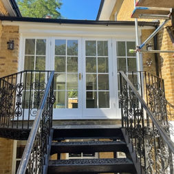 steps and newly repainted doors to house extension