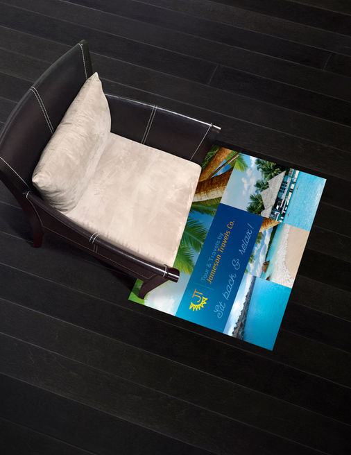 Rectangular lifestyle floor decal under a lounge chair on gray tile flooring.