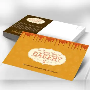 Close-up of logo and headline highlighted with raised spot UV on an elegant white postcard.