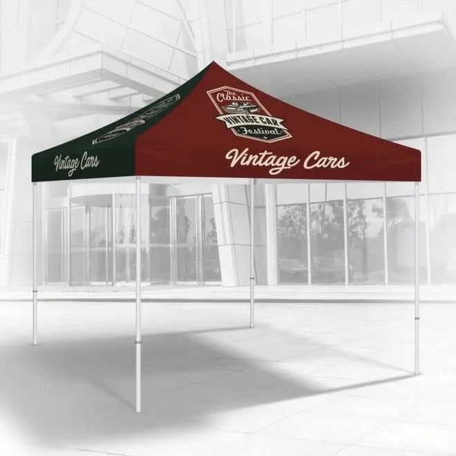 Pop‑up canopy tent with red and green panels printed with Vintage Cars logo in a showroom