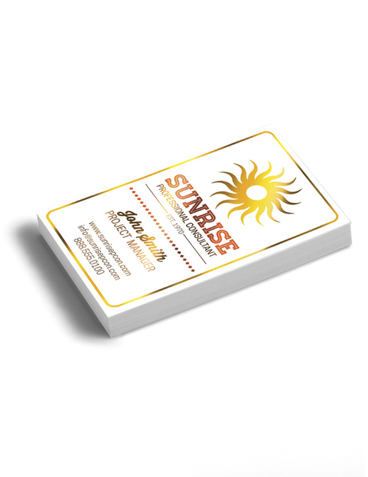 A small stack of white business cards with a full-color foil sun design in the upper right corner. The text 'Sunrise' is printed in black below the sun design.