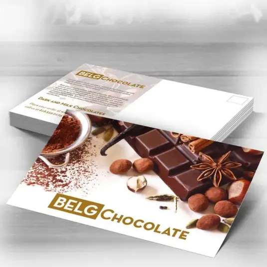 Postcard featuring “Belg Chocolate” with cinnamon sticks and chocolate pieces.