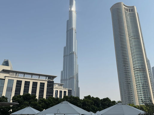 Photographer capturing landscapes at a dream travel destination with mountains, oceans, and dramatic light.