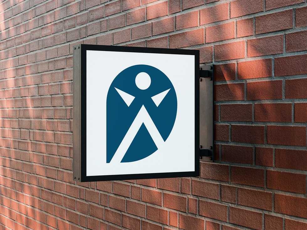 People With Purpose icon design on a sign attached to a brick wall