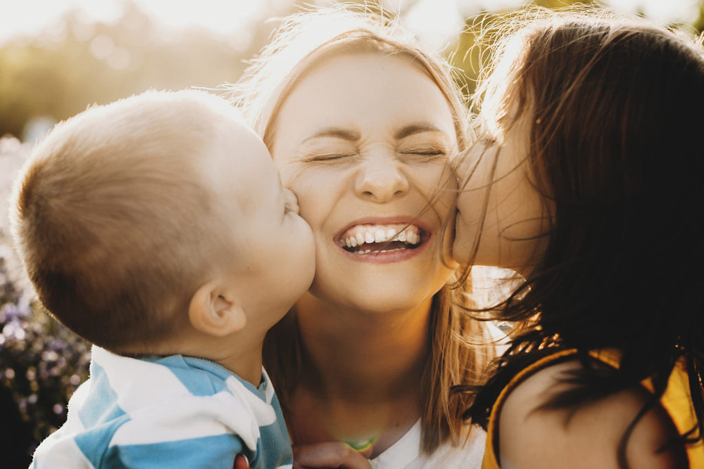 a mother feeling energized and happy after using tips she learned from her Marble Wellness Maternal Mental Health Therapist. Marble Wellness is a practice located in Ballwin, Mo 63011 helping people to feel like themselves again.
