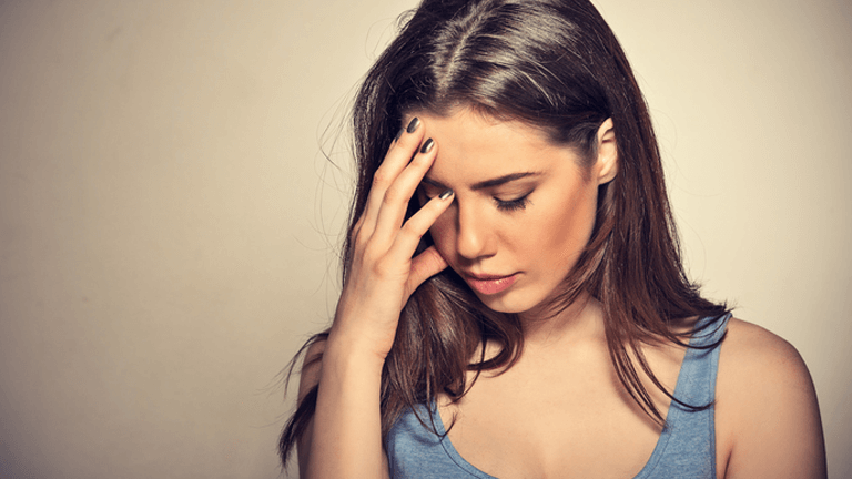 a woman dealing with low grade anxiety and feeling tired, edgy and worried. Marble Wellness specializes in anxiety, depression, moms who are overwhelmed, postpartum and more. Marble Wellness is a therapy practice in west county, mo.
