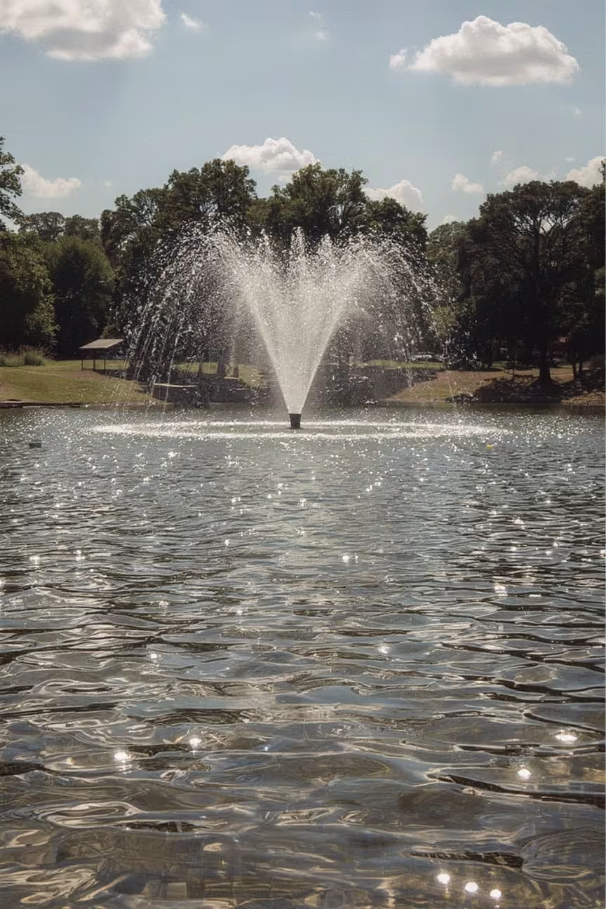 A Photo of the Fountain in the Middle of the Main Pond at Dennis Johnston Park in Spring TX. 
