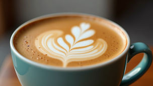 A Photo of a Close-up of a beautifully decorated Okinawa Latte with artistic latte art