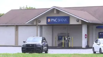 Police locate Monroe County bank robbery suspect on roof of house