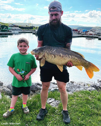 8-year-old Aiden of Cambria County caught a 36-inch carp while bass fishing with his dad