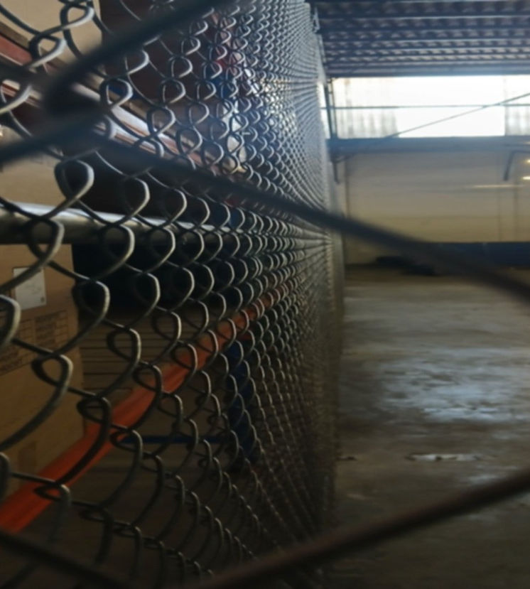 Heavy-duty welded mesh fence installation in Cape Town warehouse by Fence-In & Gates