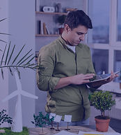 man-using-tablet-eco-friendly-wind-power-project-layout_edited.jpg