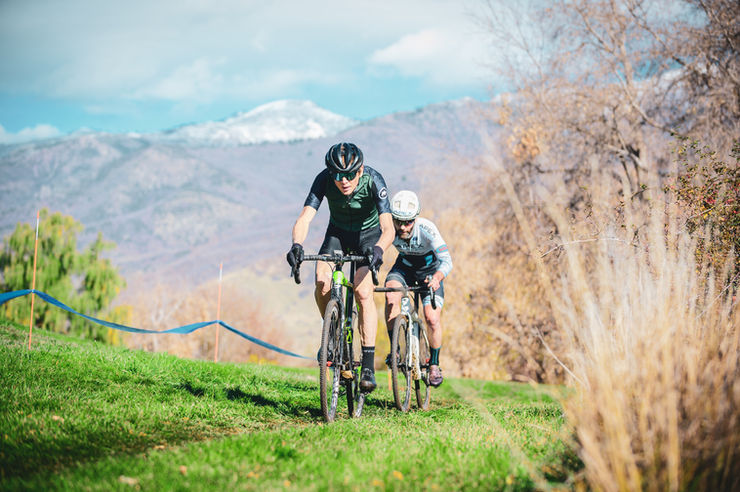 The image shows a cyclocross race at a farm field in Kaysville.