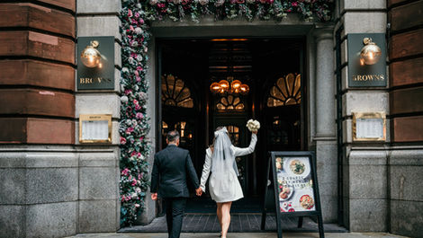 Bride arriving at Manchester wedding venue entrance