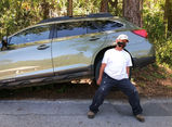Manny lifting Kathys Subaru.jpg
