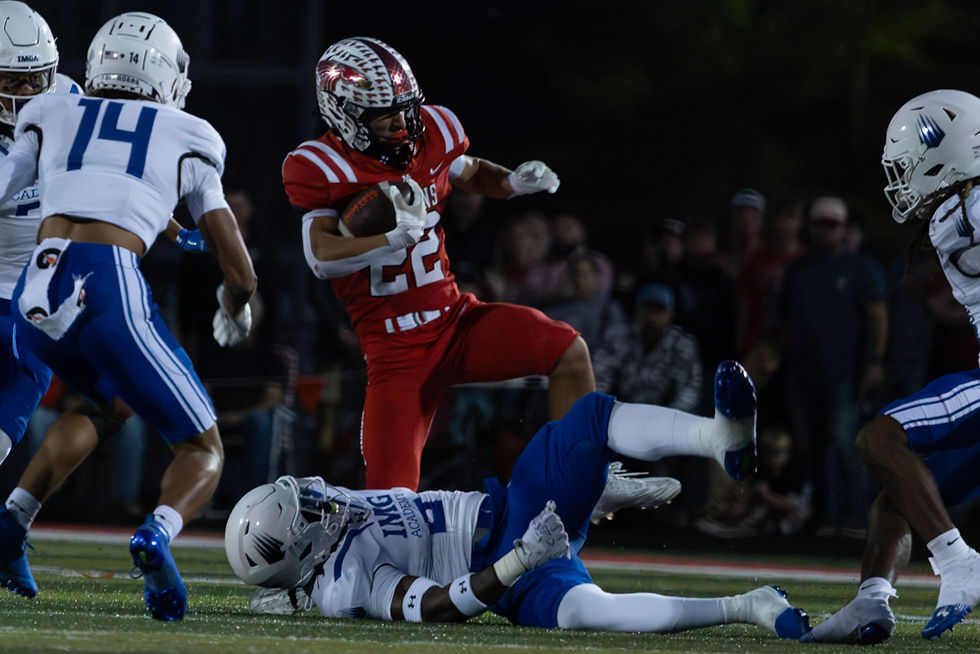 New Palestine high school Junior, Logan Parks (22), runs the ball in the IMG Academy at New Palestine game on Friday, October 9, 2026 in New Palestine, Ind.