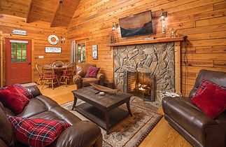 Custom living room with a cozy fireplace in this Boone, NC Airbnb.