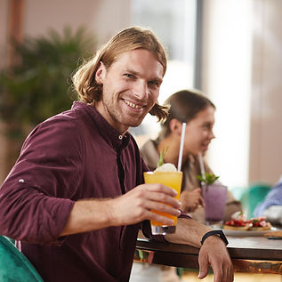 handsome-man-enjoying-cocktail-2023-11-27-05-09-14-utc_edited.jpg