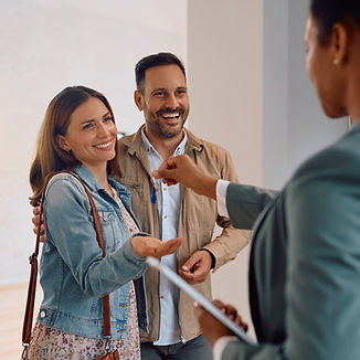 happy-couple-receiving-keys-of-their-new-house-fro-2024-09-05-21-48-15-utc_edited.jpg