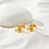 Thumbnail: dainty flower petal earrings gold