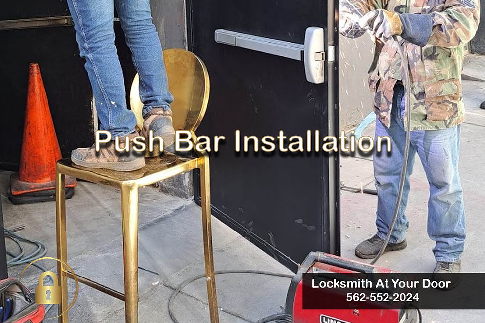 Men working on installation a push bar on a business.