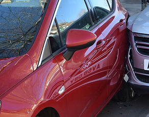 Images of two cars involved in a road tr