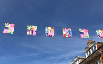 screen-printed flags hanging in streets