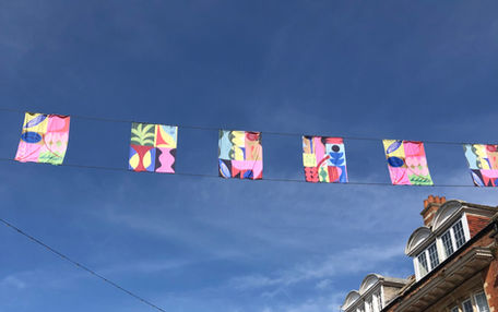 screen-printed flags hanging in streets