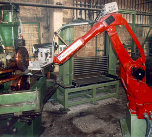 Robotic loading of parts into the machine