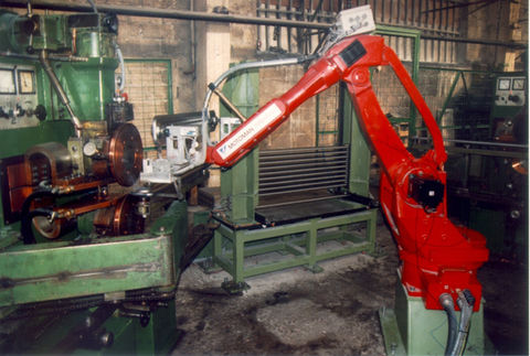 Robotic loading of parts into the machine