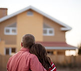 People in front of a house