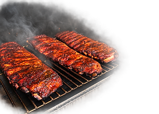 Ribs cooking on the grill at BIG Meats