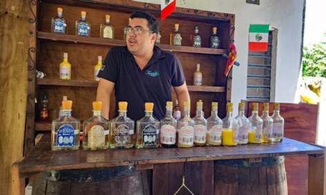 Man with tequila tasting bottles