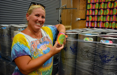 Chery McBay holding beer cans
