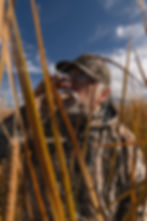 Hunter blowing duck call