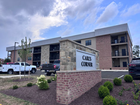 a multi-family apartment building with brick and siding