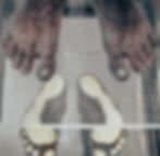 Close-up of feet undergoing a biomechanical scan for foot analysis using pressure mapping technology